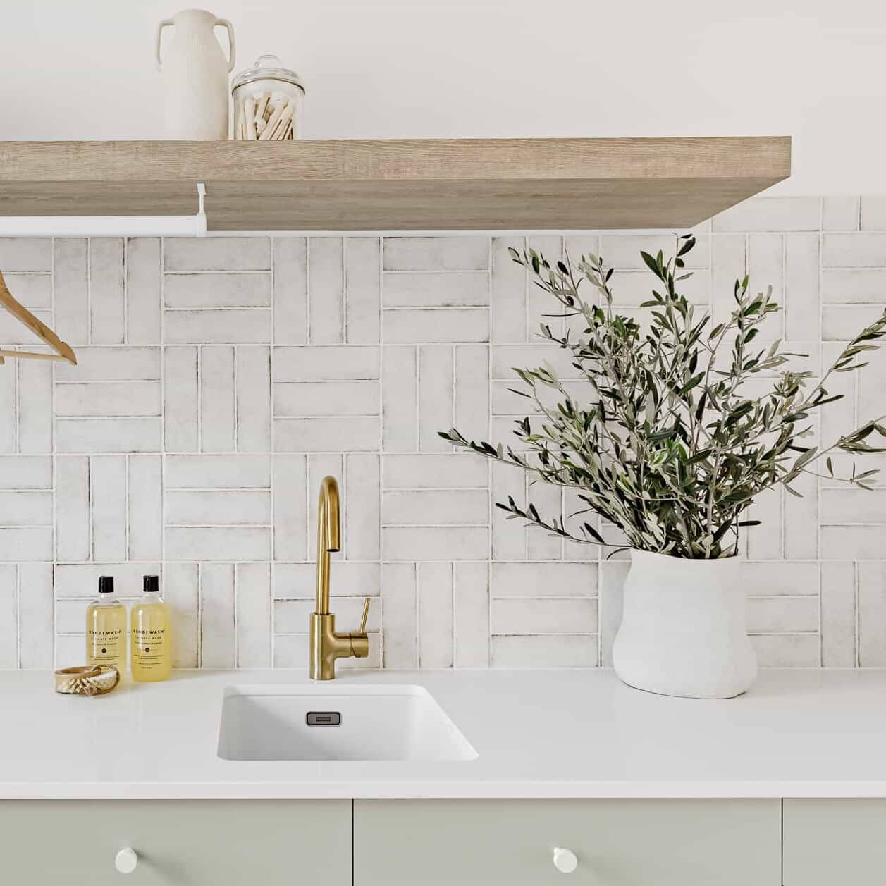 subway tiles with gold tap