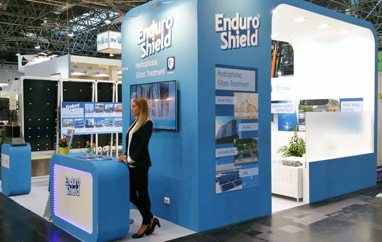 girl in front of stand at glasstec