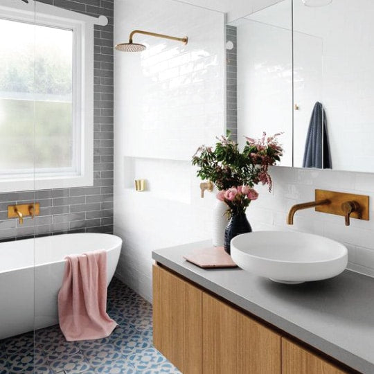 white bathroom wall tiles near bath and shower screen