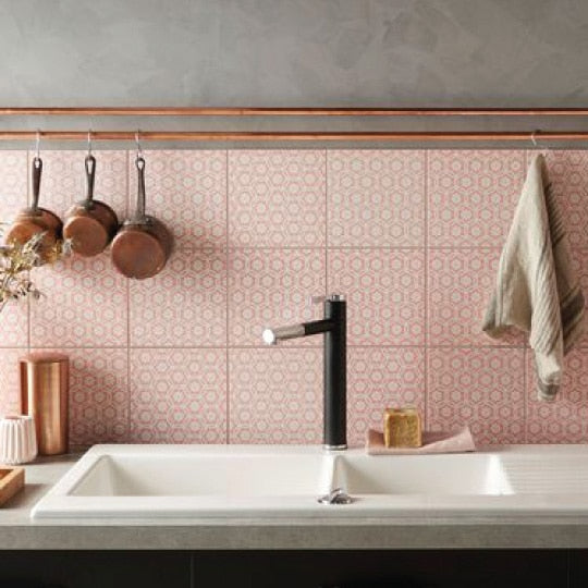 pink kitchen tile splashback with black tap